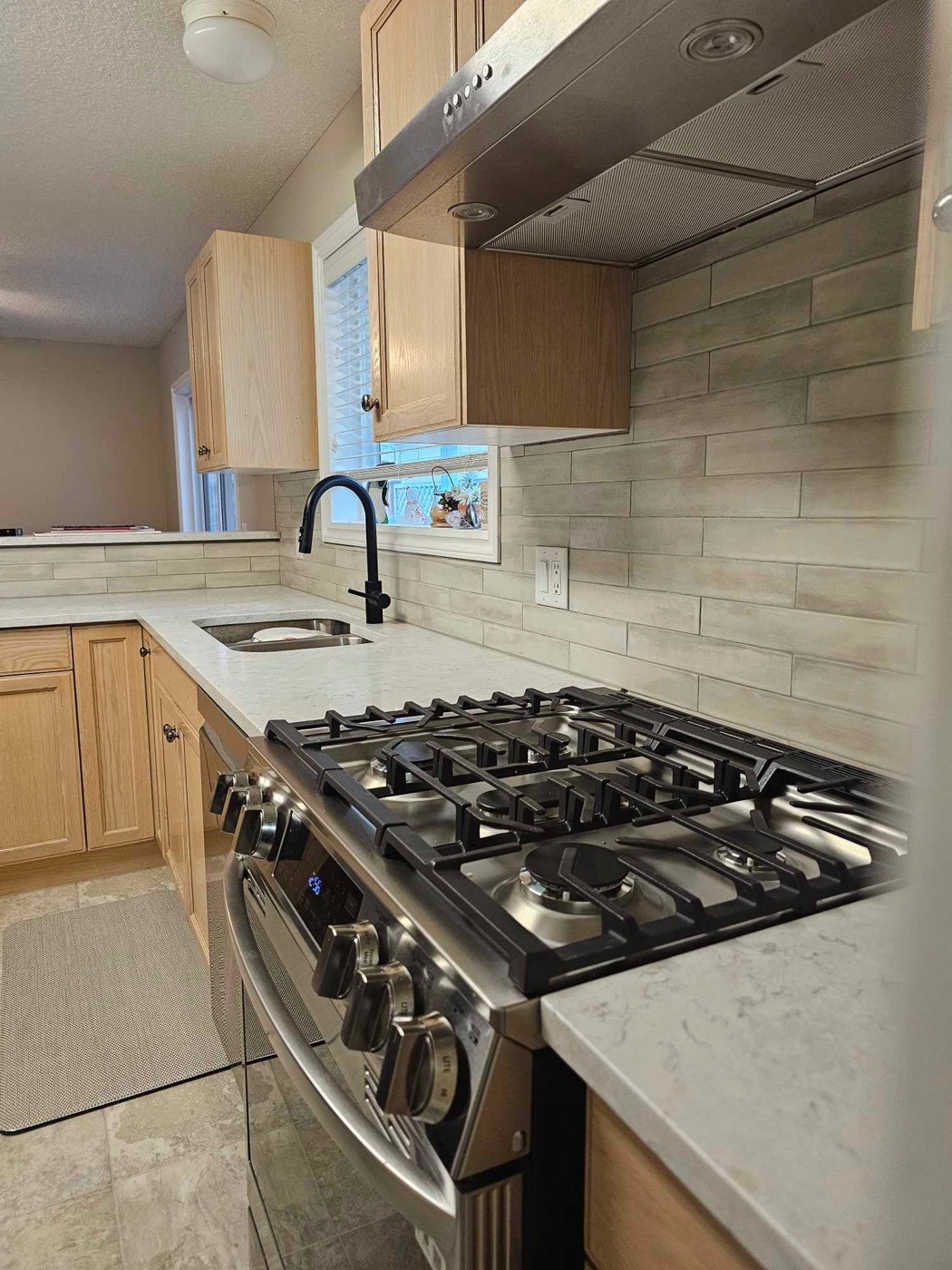 Wood-look plank tile kitchen backsplash